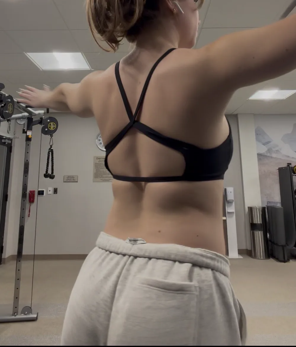 Before back-view fitness transformation photograph